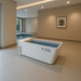 MedEq acrylic plunge pool with integrated chiller/heater, filled, in an open room