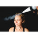 Cone nozzle spraying CO2 vapor across a woman's forehead during a facial with the America Cryo SubZero fat reduction machine