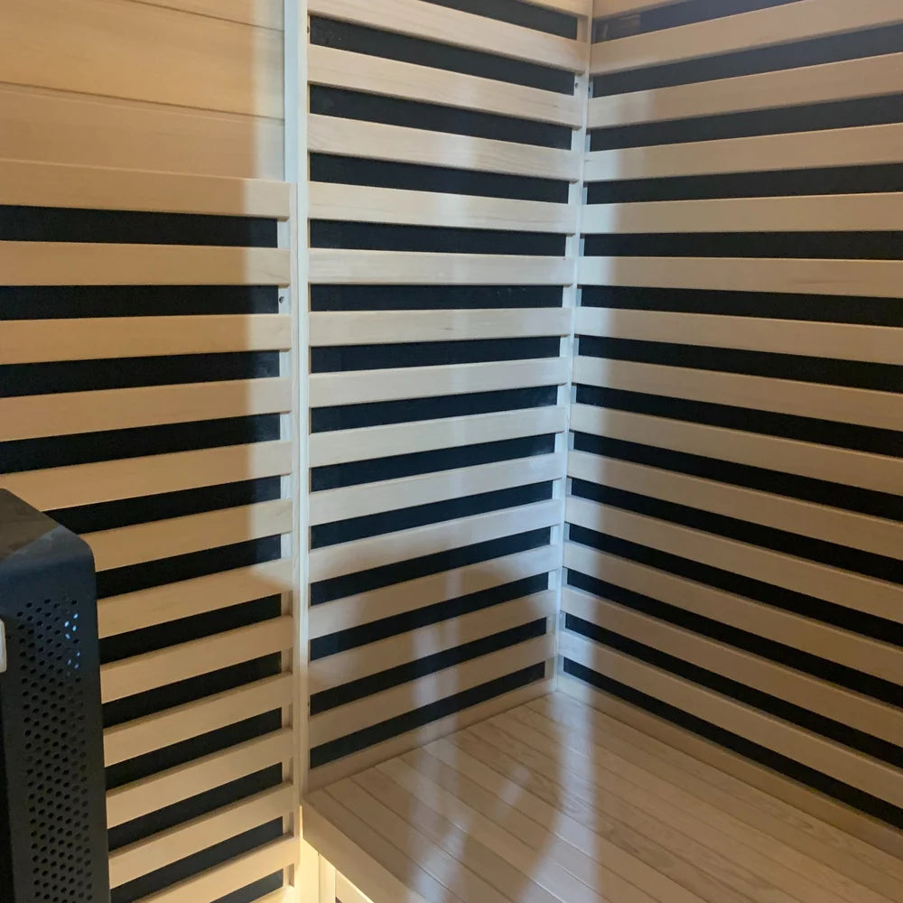Slatted backrest, bench and heater walls with the therapy panel edge in the Blisspod Bergen Chromotherapy Sauna