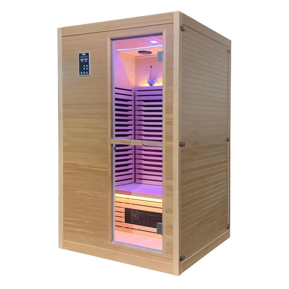 Blisspod Helsinki Infrared Sauna photographed at an angle with the door open and interior lighting on