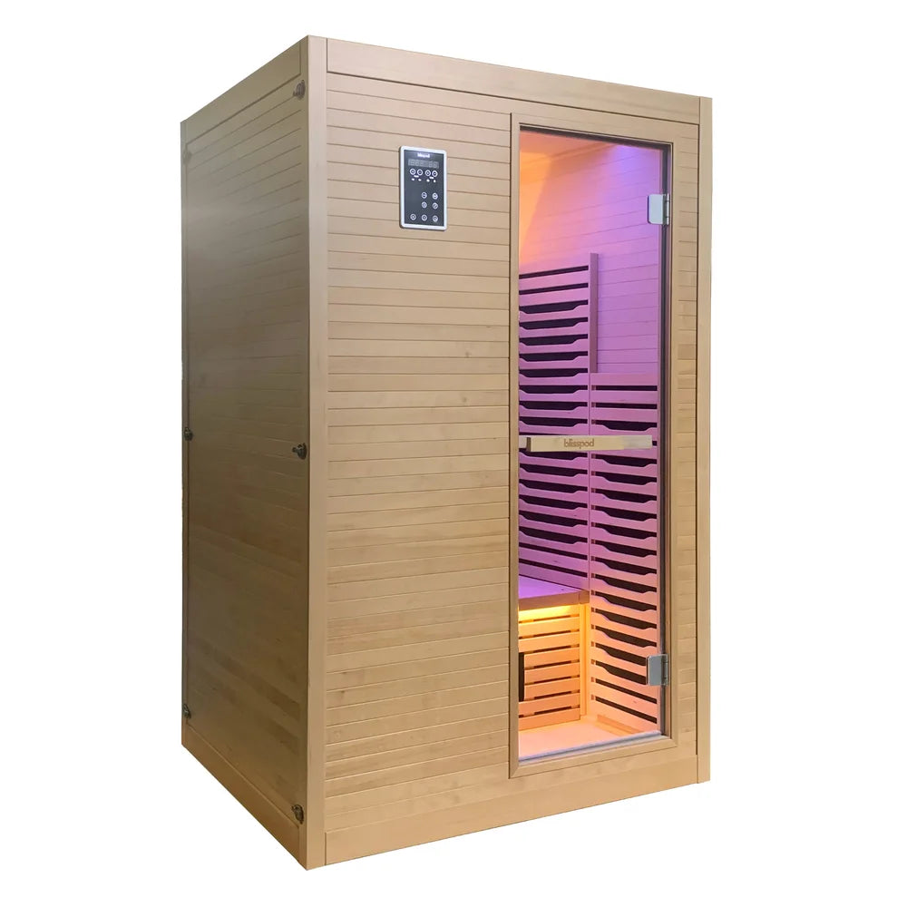 Angled studio view of the Blisspod Helsinki 2 Person Sauna cabin with lit interior behind the glass door