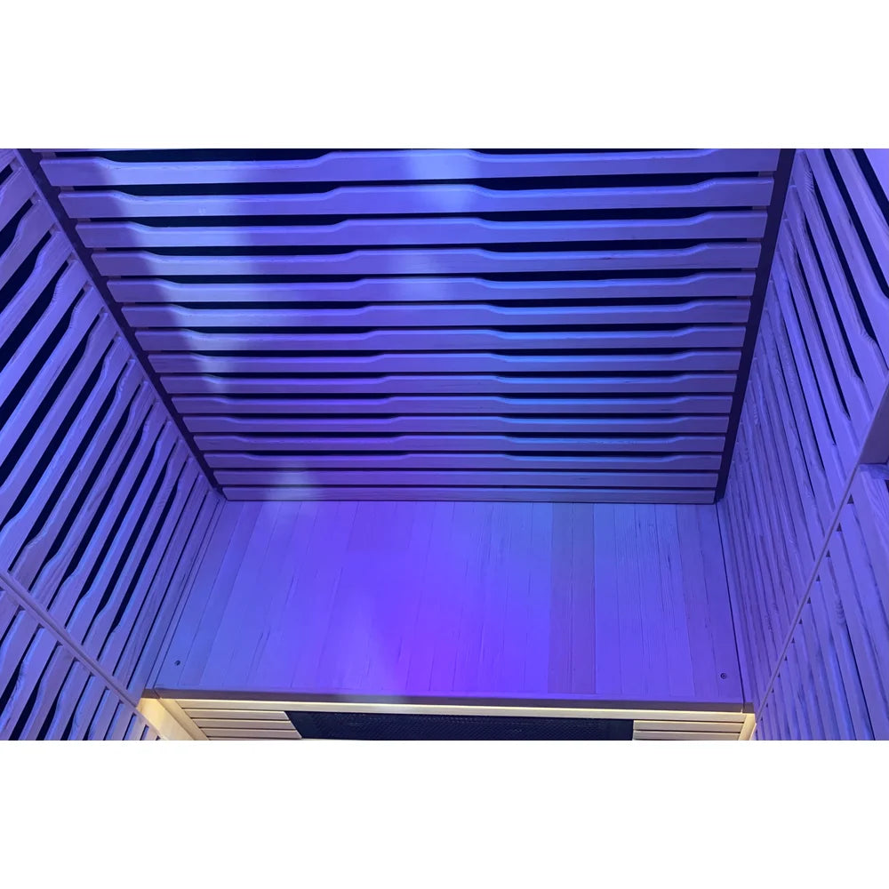 Ceiling and rear slats glowing purple from the LED strips of the Blisspod Helsinki Sauna Pod cabin