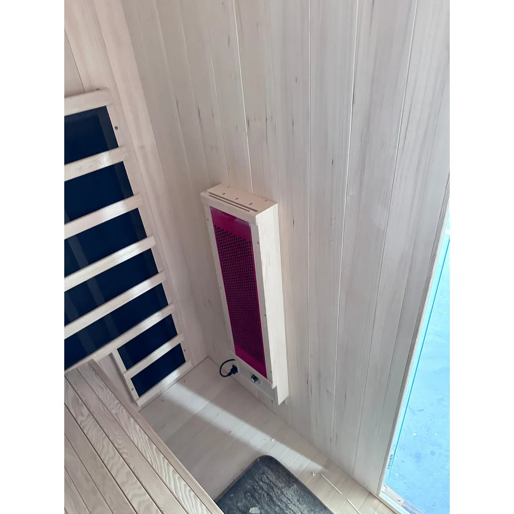 Installed corner heater panel and wiring inside the Blisspod Milano Full Spectrum Sauna, photographed in place