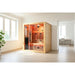 Blisspod Venetian RED Infrared Sauna placed in a white apartment room with windows and a potted plant nearby