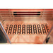 Oxygen ion stones embedded in the wooden footrest above the floor heater in the Blisspod Venetian RED Infrared Sauna