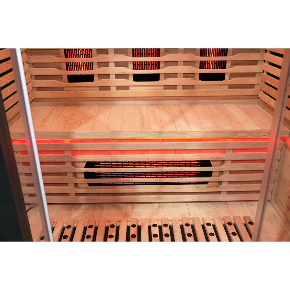Wooden bench with glowing under-bench heater and red LED strip inside the Blisspod Venetian RED Sauna