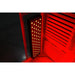 Large LED therapy panel glowing deep red against the wood slat wall of the Blisspod Venetian RED Red Light Therapy Sauna