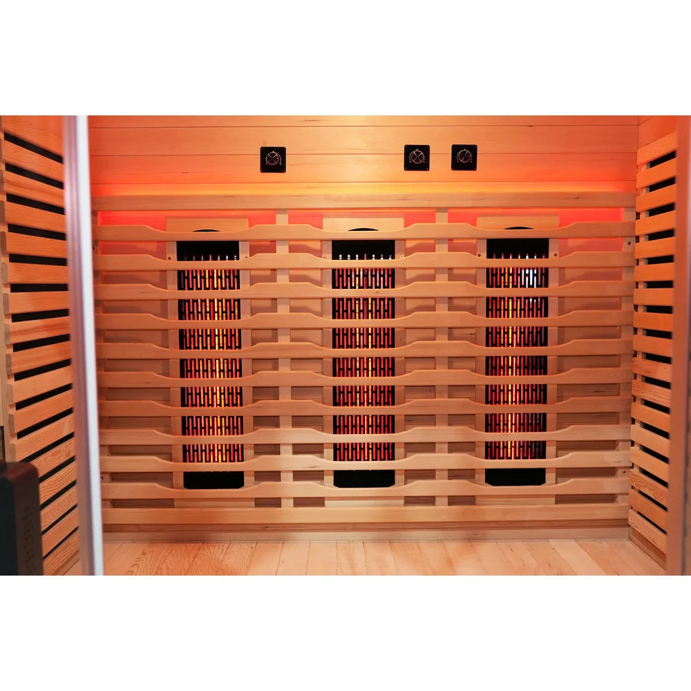 Three glowing back heaters with individual intensity knobs above them in the Blisspod Venetian RED Deluxe Sauna