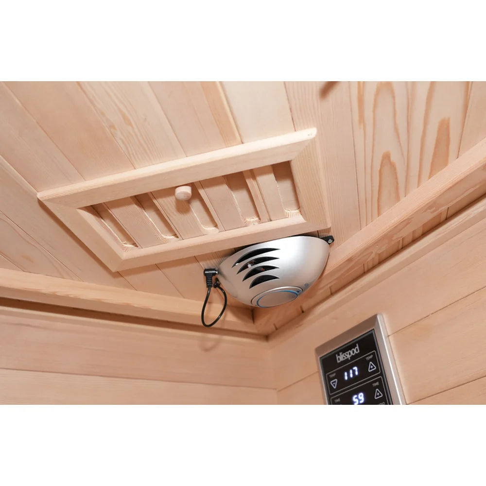 Silver oxygen ionizer and slatted hemlock air vent on the ceiling of the Blisspod Vienna RED Corner Sauna