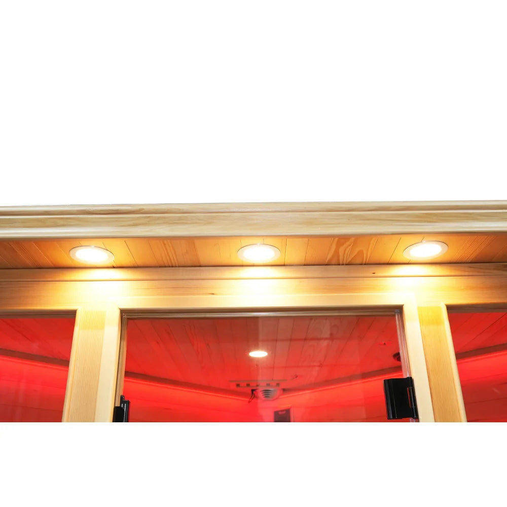 Three warm recessed accent lights under the roof edge of the Blisspod Vienna RED Corner Sauna above the glass door