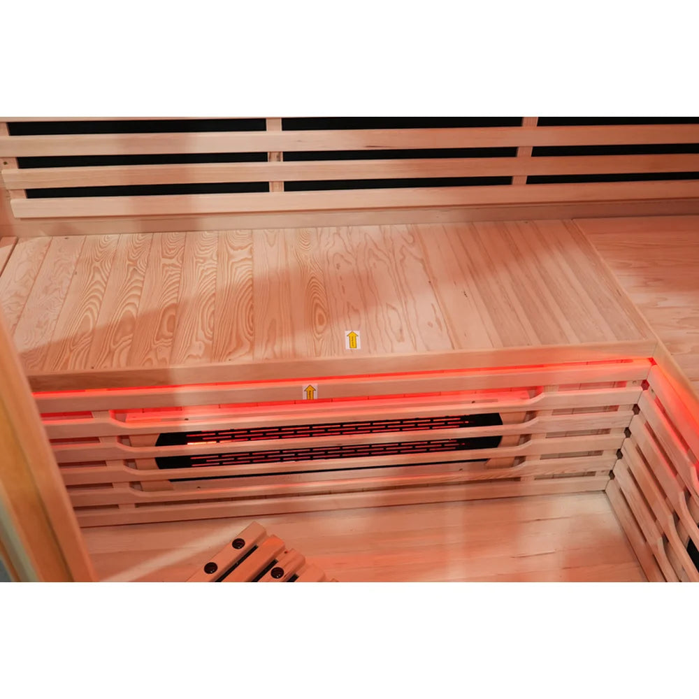 Hemlock bench above a glowing under bench leg heater and red LED strip in the Blisspod Vienna RED cabin
