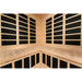 Interior rear walls of the Blisspod Vienna Hemlock Sauna lined with tall black carbon heater panels above the bench