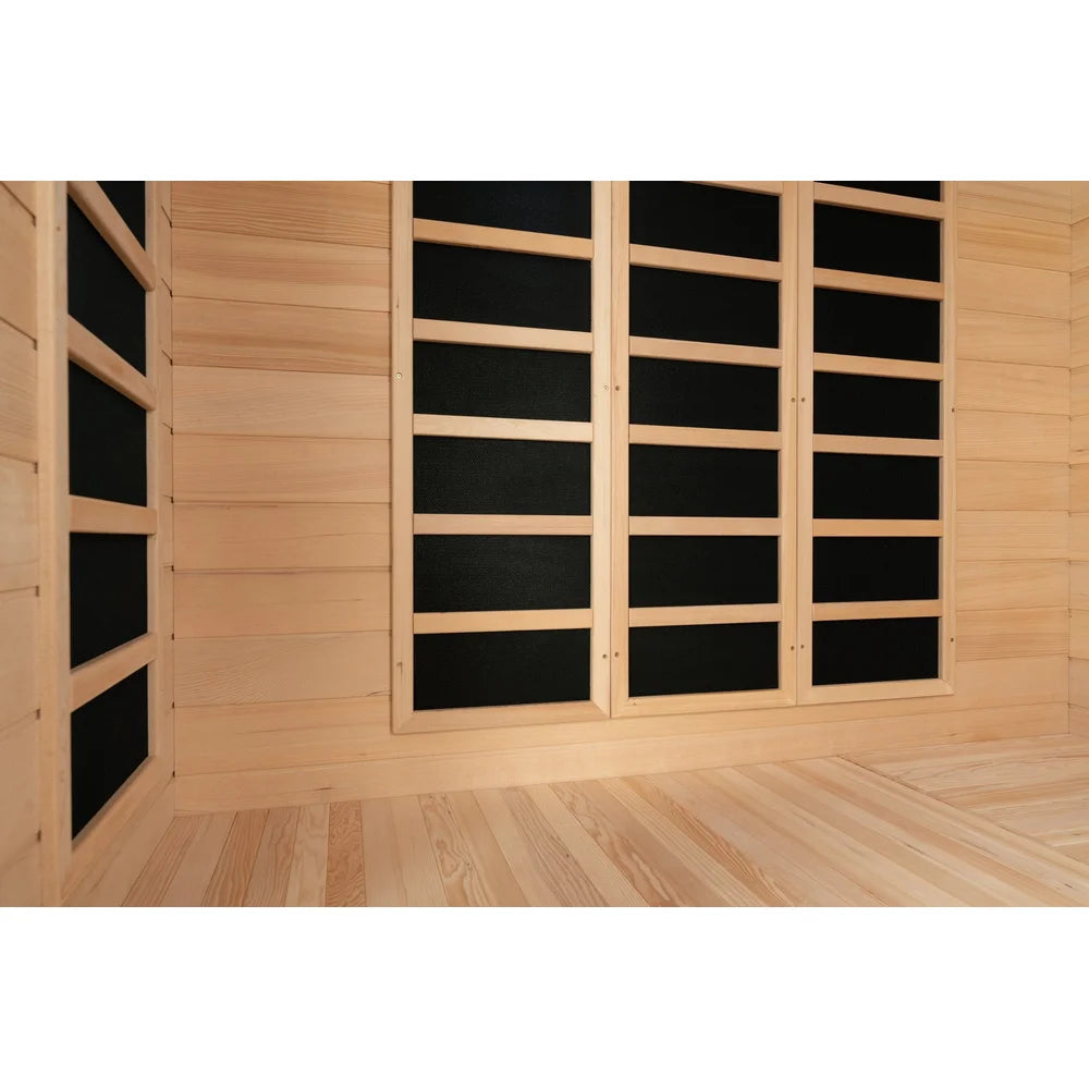 Close view of framed black carbon panels and hemlock plank walls inside the Blisspod Vienna Sauna cabin