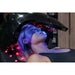 Face bathed in blue and white LED light under the dome of the Vacu Activ Red Couch Oxy Oxygen Therapy Device
