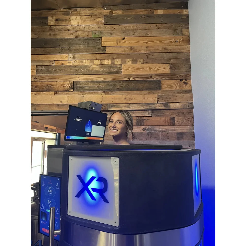 Woman in session inside the Cryo Innovations XR Whole Body Cryotherapy Chamber Machine at -158°f on screen