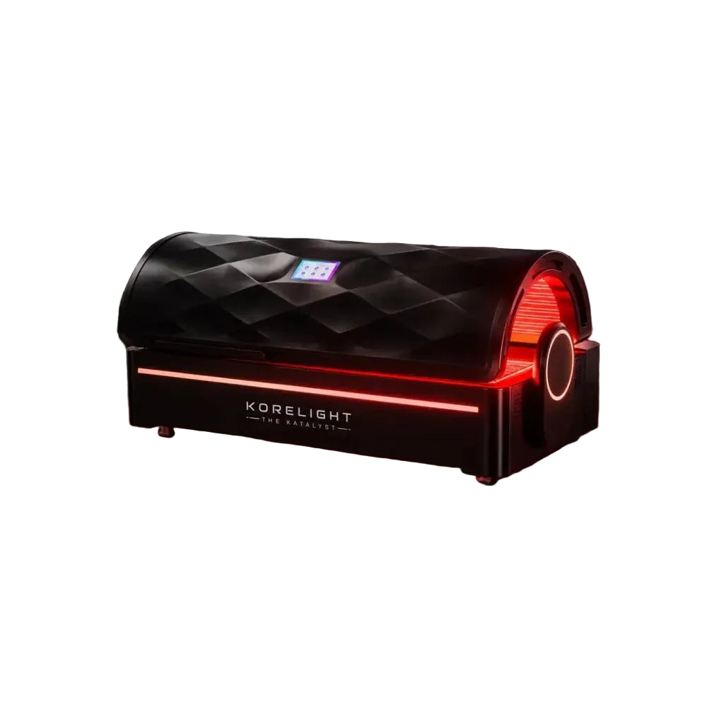 Closed diamond-textured canopy of the Kore ELITE Red Light Therapy Systems bed with red base lighting on black