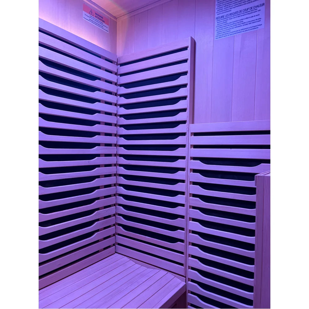 Corner wall carbon heaters behind hemlock slats in the Blisspod Milano Full Spectrum Sauna interior