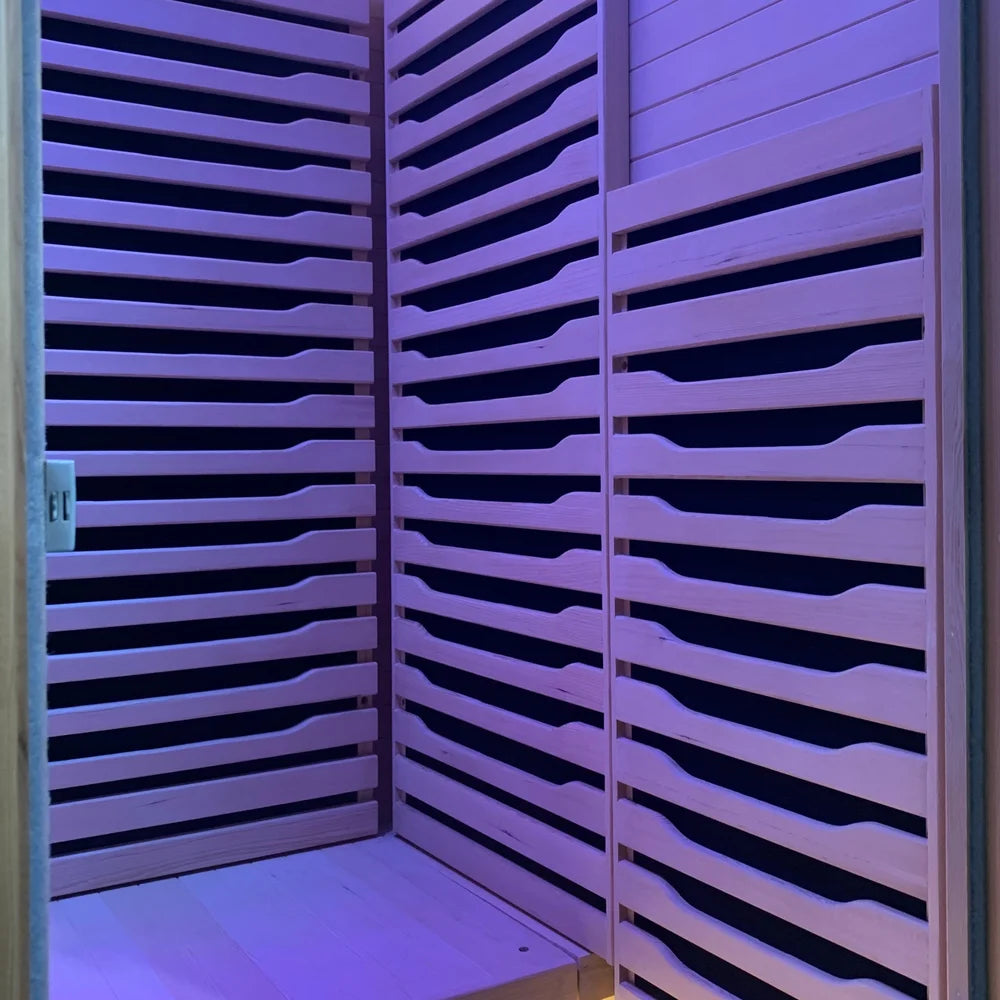 Two full height slatted infrared heater panels meeting in the Blisspod Helsinki Chromotherapy Sauna corner