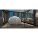 White Dreampod Sport Float Pod with closed dome lid installed in a marble spa bathroom beside twin basins