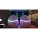 Blue and pink LED entry seam lighting shown on two Dreampod Sport Isolation Tank units in a dark room