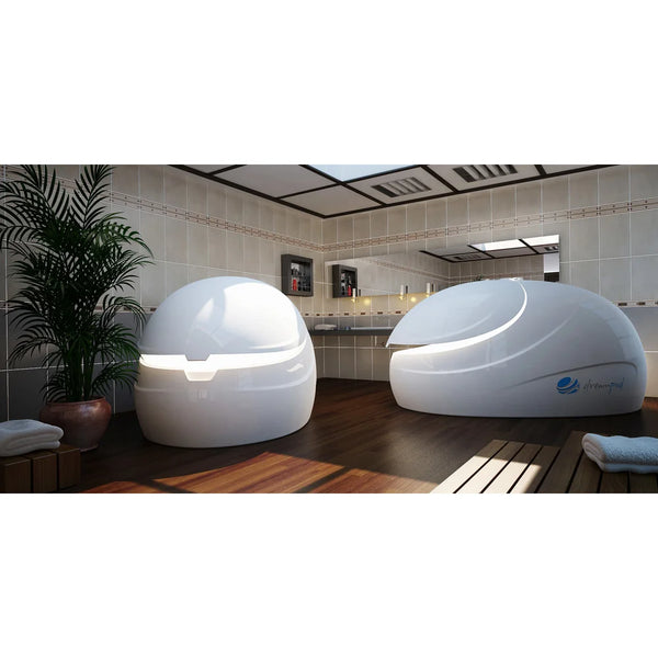 Two Dreampod Sport pods in a tiled treatment room, one head-on with a lit entry seam and one in side profile