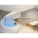 Open white Dreampod V2 with pale blue salt water, hanging neck pillow and gas springs in a grey float room
