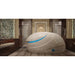 Glossy white Dreampod V2 Isolation Tank with blue door light in a wood-floored spa room with rolled towels
