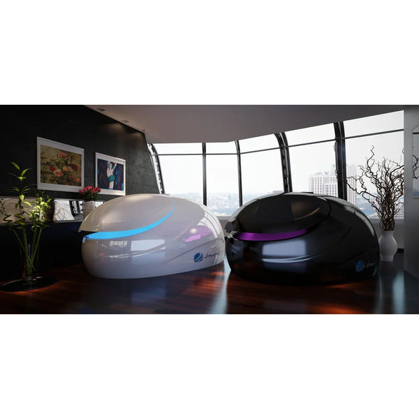 White and stealth black Dreampod V2 Float Tank models side by side with blue and purple door lighting