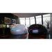 White and stealth black Dreampod V2 Float Tank models side by side with blue and purple door lighting