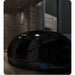 Stealth black gloss Dreampod V2 Isolation Tank with closed lid reflecting light in a dark marble interior