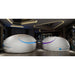 Pair of white pods with blue and purple lit door seams under sculpted ceiling lights, Dreampod Vmax Sensory Deprivation Tank duo