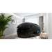 Gloss black pod with blue side logo and closed lid in a bright room with a palm, the Dreampod Vmax in black finish