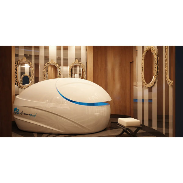 White pod with raised door and deep blue interior light in a wood panelled salon, the Dreampod Vmax Float Tank on display