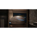 Pearl white pod with open curved lid and blue rim light seen through a doorway, Dreampod Vmax Float Tank in a dark suite