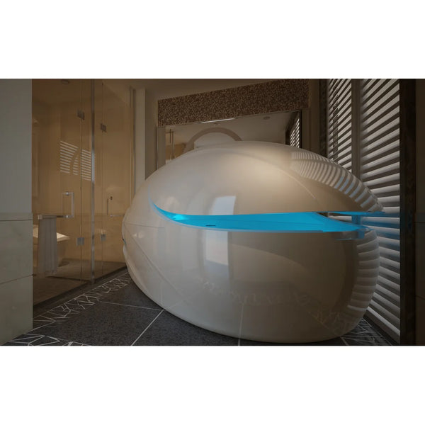 Cream pod with lid raised and blue interior glow in a tiled wet room, showing the Dreampod Vmax beside a glass shower
