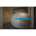 Cream pod with lid raised and blue interior glow in a tiled wet room, showing the Dreampod Vmax beside a glass shower