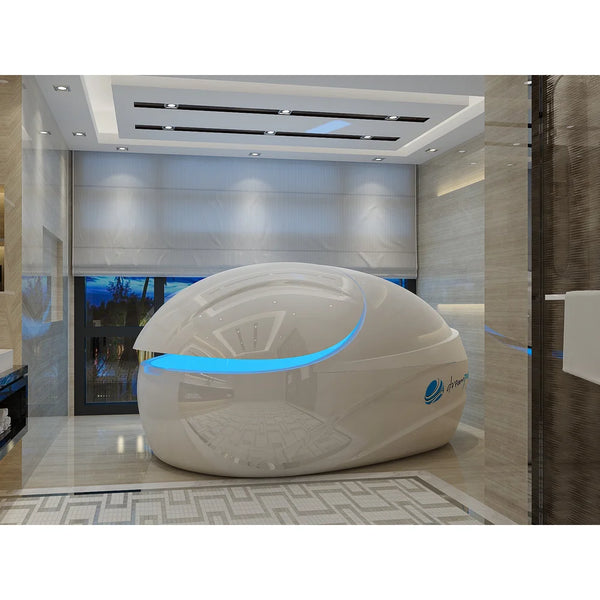 Pearl white pod at a three quarter angle with open lid and blue rim light in a marble bathroom, the Dreampod Vmax Sensory Deprivation Tank