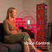 Woman speaking voice commands like turn on the light to operate the EXESAS ELITE 1800PRO Full Body Red Light Panel