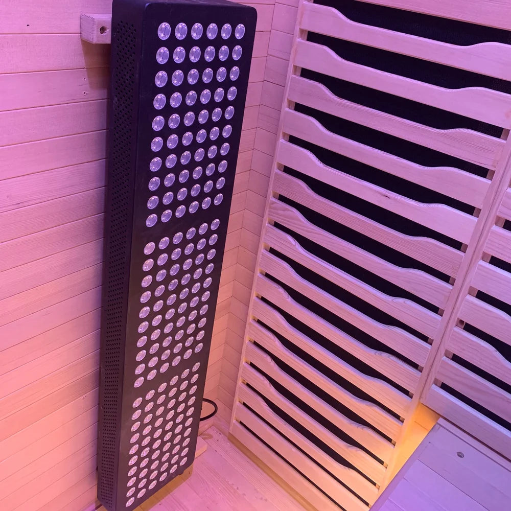 Tall lensed LED red light therapy panel installed inside the Blisspod Helsinki Full Spectrum Sauna