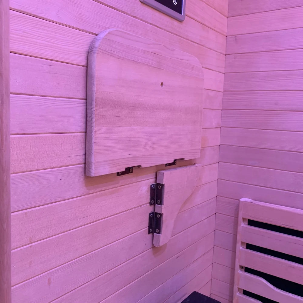 Hinged wooden backrest stowed flat against the wall of the Blisspod Helsinki 2 Person Sauna interior