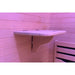 Hinged fold-down tray with cup recess under pink light in the Blisspod Helsinki Red Light Therapy Sauna