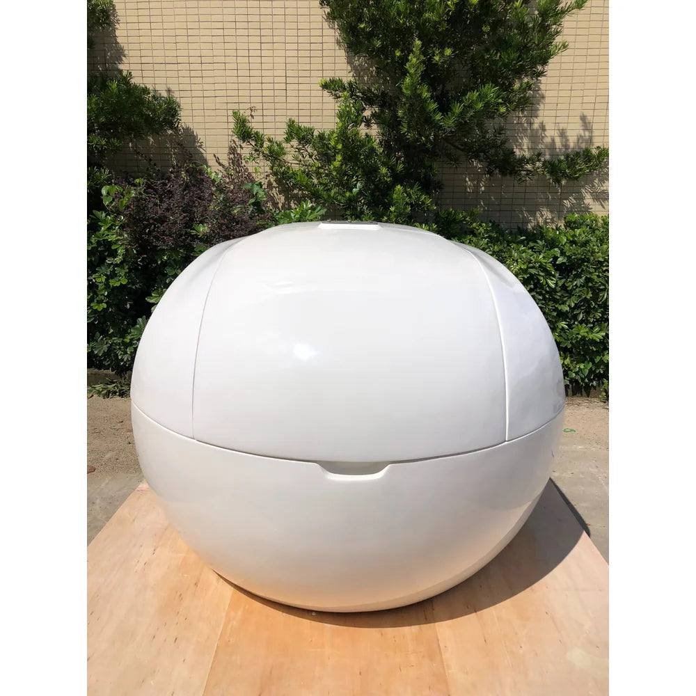 Head-on view of the Dreampod Home Float Plus showing its domed lid, panel seams and recessed handle