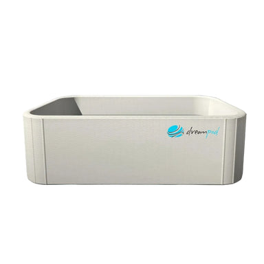 White rectangular inflatable tub of the Dreampod Home Float FLEX viewed straight on, showing textured PVC walls