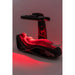 Complete side view of the Vacu Activ Red Couch 360 with a goggled client lying on the glowing LED mattress