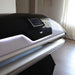 Closed black canopy and touchscreen panel detail on the Galaxy Zero Capsule LED Light Therapy Bed with white edge lighting