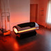 Warm orange light spilling from the end opening of the Galaxy Zero Capsule Infrared Light Therapy unit in a dim room