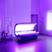 Blue light session underway inside the open Galaxy Zero Capsule Infrared Light Therapy unit with a person reclining