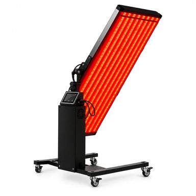 Tilted red-lit LED head, touchscreen column and rolling base of the Galaxy Zero GALAXA Full Body Light Therapy Device on white