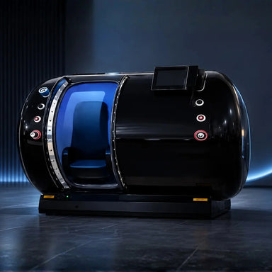 Galaxy Zero Jupiter Pro Hyperbaric Chamber in a dark studio, chrome door ring open over blue-lit seating and ports