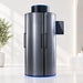 Brushed silver Galaxy Zero Onyx Touch Screen Cryotherapy Chamber at an angle with blue base lighting and black bar handles